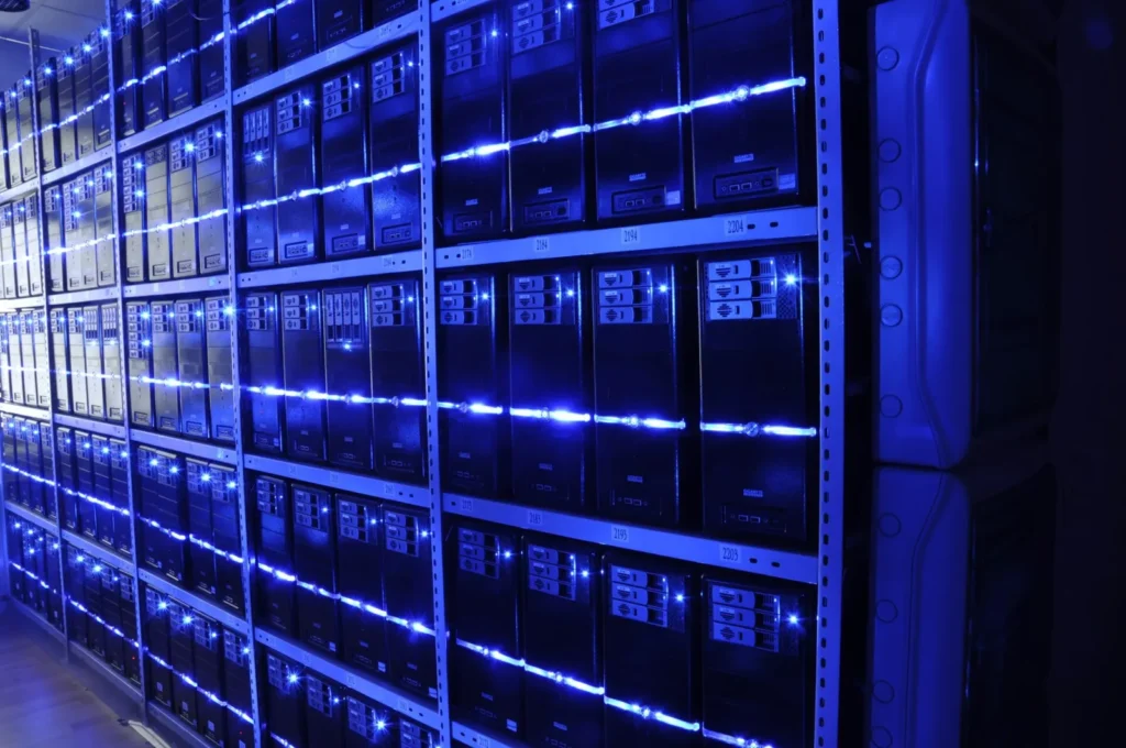 Server racks in a data centre running open-source AI moderation models