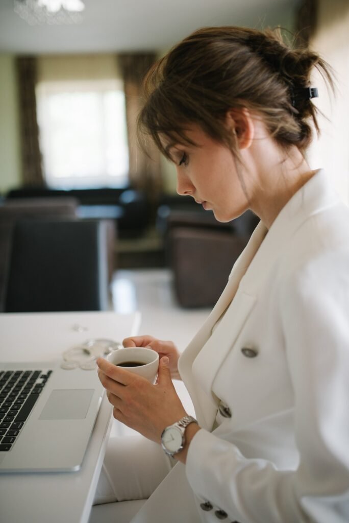 How AI Assistants Are Changing Everyday Office Work Office worker using AI tools on a computer